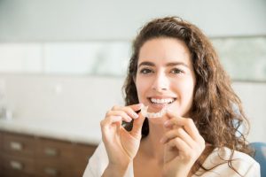 a woman is getting Invisalign